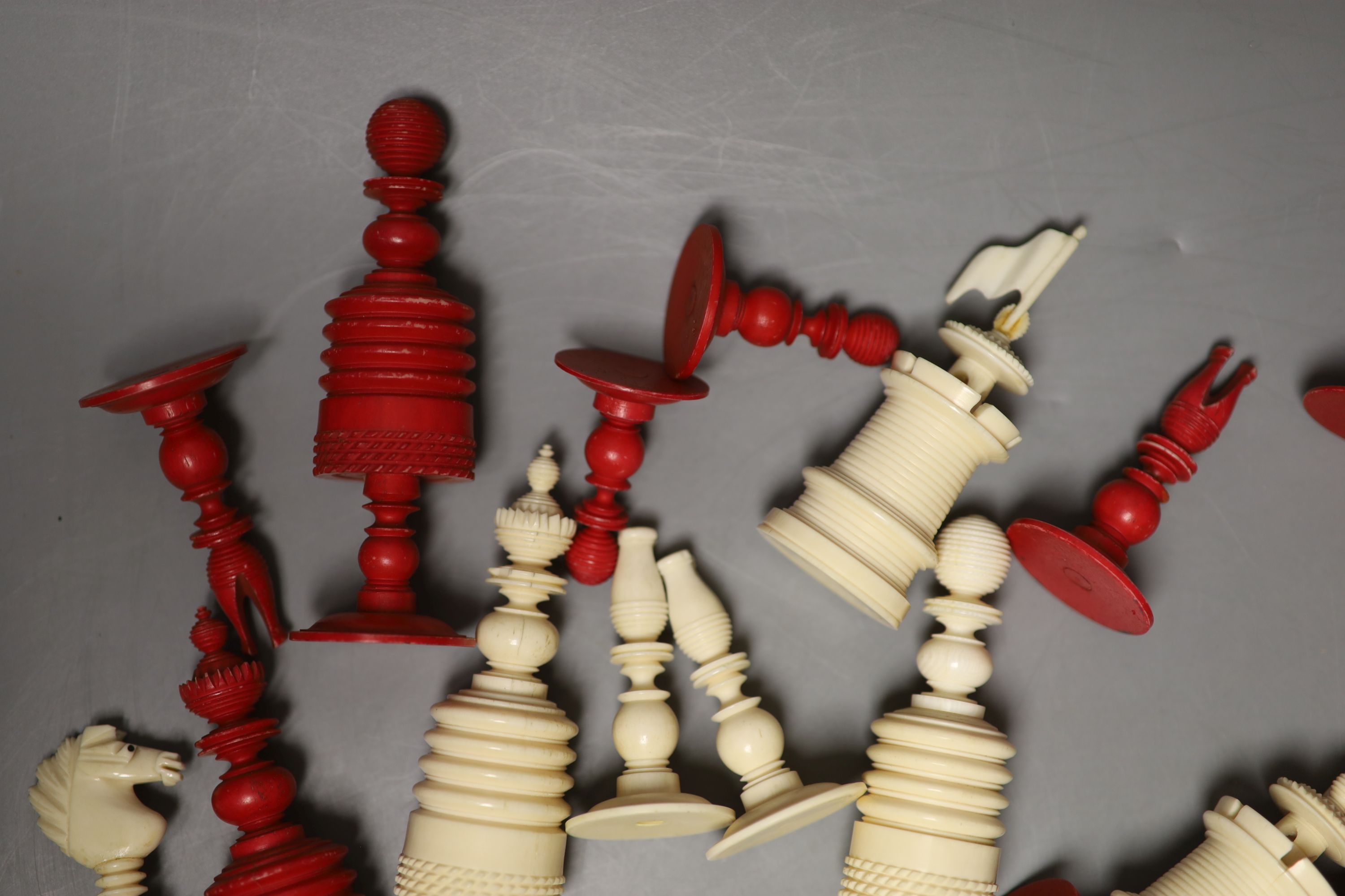 A 19th century natural and red stained bone chess set